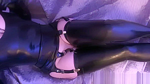 Amateur girl in latex masturbates with a glass dildo