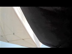 Amateur upskirt with panty flash between stretched legs