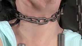 BDSM sub wrapped in chains and spanked