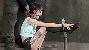BDSM sub wrapped in chains and spanked