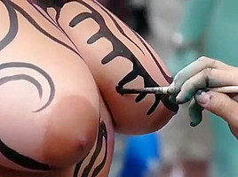 Big tits girl public body painting