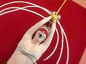 Bound and blindfolded legs spread in leather trousers