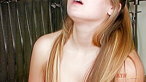 Cute teen loves pleasuring her cunt while lying down on the floor