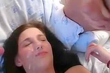 Double cumshot on a teenage cute face