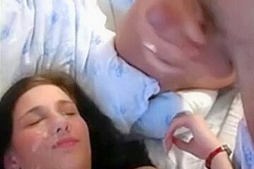 Double cumshot on a teenage cute face