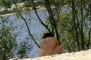 Mature lady with nice natural tits naked on beach