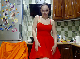 Sexy Lovegalun in a red dress plays with a dildo in the kitchen 