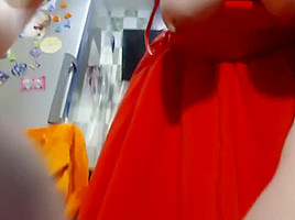 Sexy Lovegalun in a red dress plays with a dildo in the kitchen 