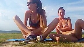 Two girls squirt and piss outdoors