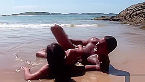 black dude eats her pussy and fucks her on the beach