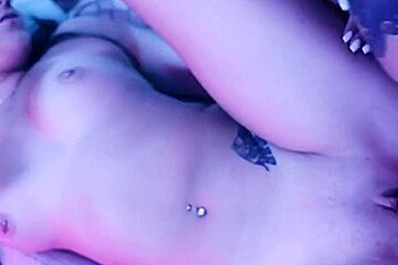 sexy blonde deepthroats a big dick in blue light