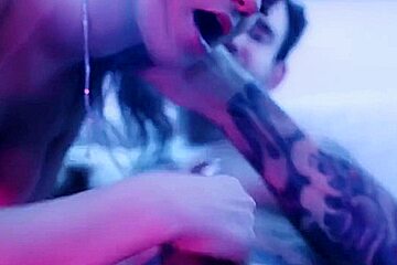 sexy blonde deepthroats a big dick in blue light